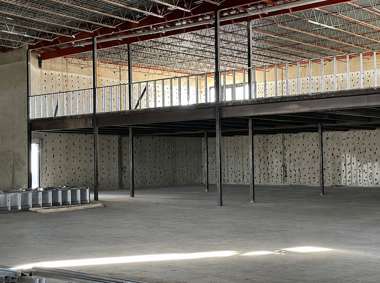 Open shell interior at Yale Landing with exposed structure and mezzanine.