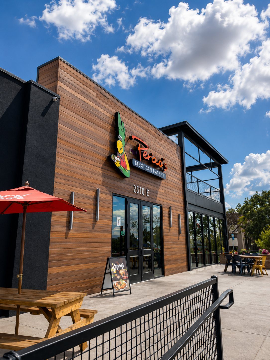 Perico's storefront at Yale Landing with wood façade and patio seating.